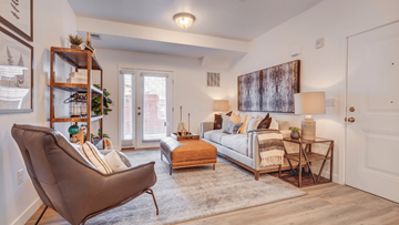 Payson apartment for rent - A living room with a brown chair and a white couch.