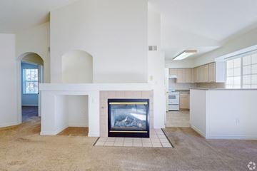 Englewood apartment for rent - A living room with a fireplace and a painting on the wall.