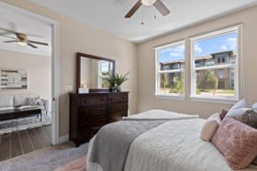 Johnstown apartment for rent - a bedroom with a large bed and a ceiling fan