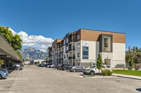 Midvale apartment for rent - a building with cars parked in front of it on a street