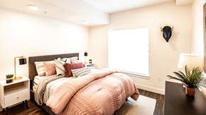 Midvale apartment for rent - a bedroom with a large bed and a window