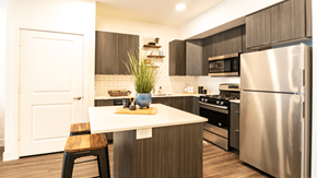 Midvale apartment for rent - a kitchen with stainless steel appliances and a white counter top