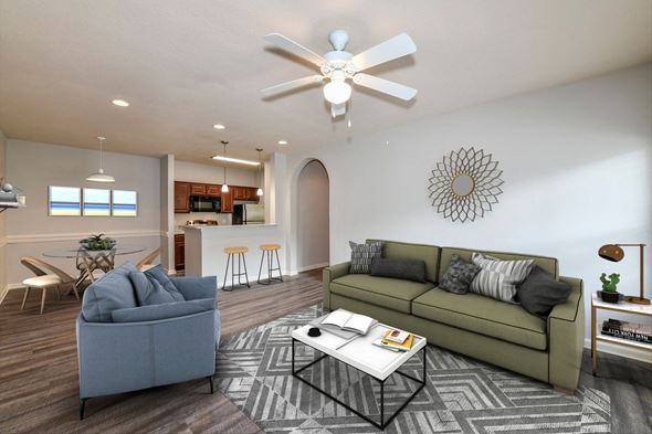 Jacksonville apartment for rent - A living room with a grey couch and a white coffee table.
