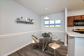 Jacksonville apartment for rent - A dining area with a glass table and chairs.