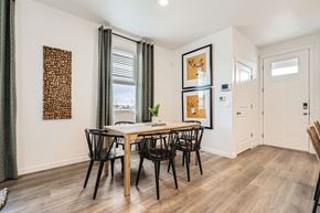 Aurora apartment for rent - A dining room with a table and chairs.