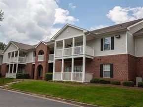 Villa Rica apartment for rent - A row of houses with white balconies and brick exteriors.
