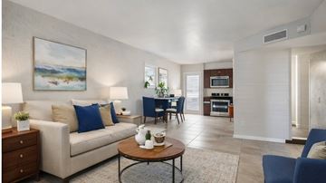 Phoenix apartment for rent - A living room with a painting of a landscape on the wall.