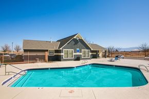 Albuquerque apartment for rent - A swimming pool in front of a house.
