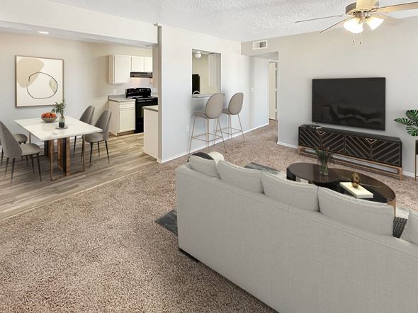 Albuquerque apartment for rent - A living room with a grey couch and a television.