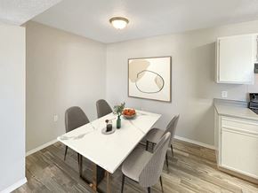 Albuquerque apartment for rent - A dining room with a white table and chairs.