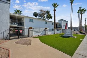 Phoenix apartment for rent - A white building with a black gate and a sign that says "Congress".