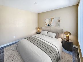 Casa Grande apartment for rent - A bedroom with a large bed and a painting on the wall.