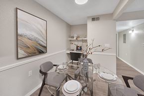 Sherwood apartment for rent - A dining room with a glass table and chairs.
