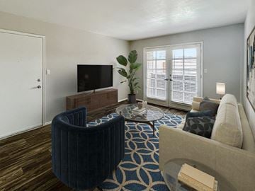 Phoenix apartment for rent - A living room with a blue chair and a television.