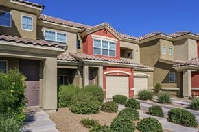 Las Vegas apartment for rent - A row of houses with brown and tan exteriors.