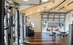 Colorado Springs apartment for rent - A gym with a variety of equipment including treadmills, weights, and exercise machines.