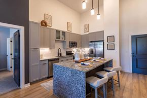 Nashville apartment for rent - a kitchen with an island and a table with chairsat Sterling Nashville West Apartments, Nashville