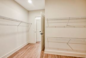 Smyrna apartment for rent - a bedroom with white walls and wood flooring