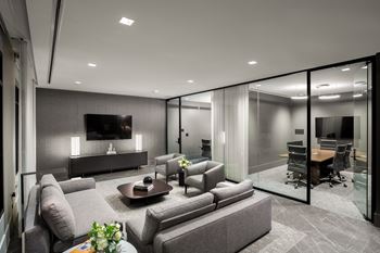 A living room filled with furniture and a large window