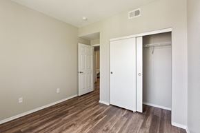 San Jose apartment for rent - a bedroom with a closet and a door to a bathroom