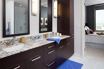 Modelhomes-dual vanity with framed mirrors in select apartments