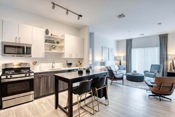 Hopkinton apartment for rent - a kitchen and living room with a table and chairs