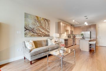 Denver apartment for rent - a living room with a couch and a table