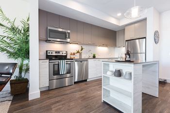 Fitted kitchen with island dining