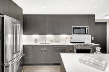 Modelhomes-fully-equipped kitchen with stainless steel appliances
