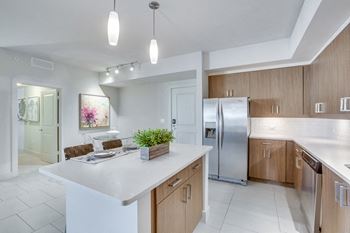 Modelhomes-tiled back splashes and under cabinet lighting
