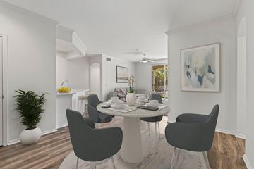 Orange apartment for rent - a living room and dining room with a table and chairs
