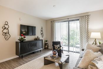 Well lit living room with tv