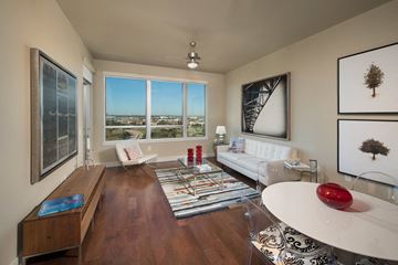Houston apartment for rent - a living room with a couch and a table    and a large window
