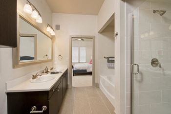 Modelhomes- large soaking tub in bathroom with tile surround