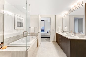 Modelhomes-modern bathroom with shower and separate soaking tub