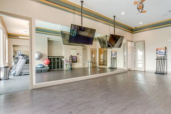 Amenities-yoga room featuring wellbeats virtual group fitness classes