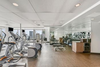 Amenities-fully equipped fitness center with floor-to-ceiling windows
