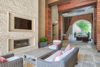 Amenities-outdoor lounge with fireplace and television
