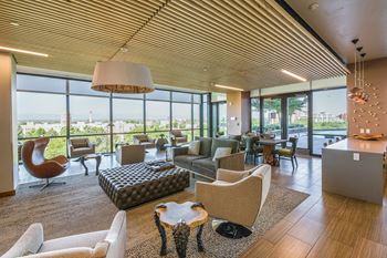 Amenities-clubroom with multiple tvs overlooking the pool deck