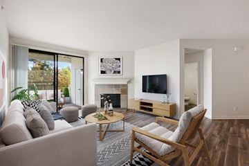 Sunnyvale apartment for rent - a living room with a couch and a tv and a fireplace