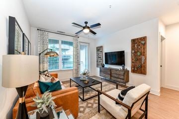Smyrna apartment for rent - a living room with a ceiling fan and a tv