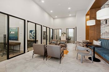 Remote working lounge/business center with workstations and private office space