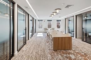 Jersey City apartment for rent - A conference room with a long table and chairs.
