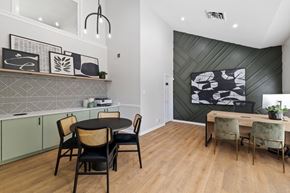 Fairfax apartment for rent - A dining room with a black table and chairs.