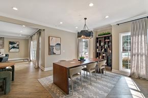 Atlanta apartment for rent - A dining room with a wooden table and chairs.