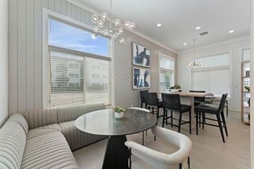 Miami apartment for rent - a living room with a couch and a table with chairs
