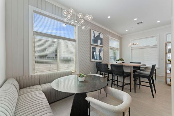 Miami apartment for rent - a living room with a couch and a table with chairs