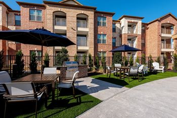 Outdoor grill with intimate seating area