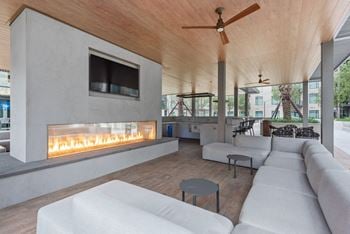 A living room with couches and a fireplace