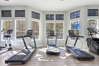 24-Hour fitness center equipped with cardio and strength training equipment